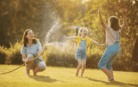 a happy family playing in the backyard